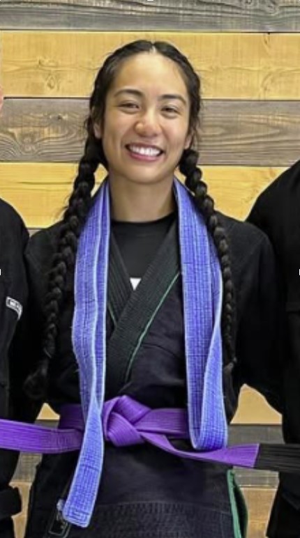BJJ training photo with purple belt